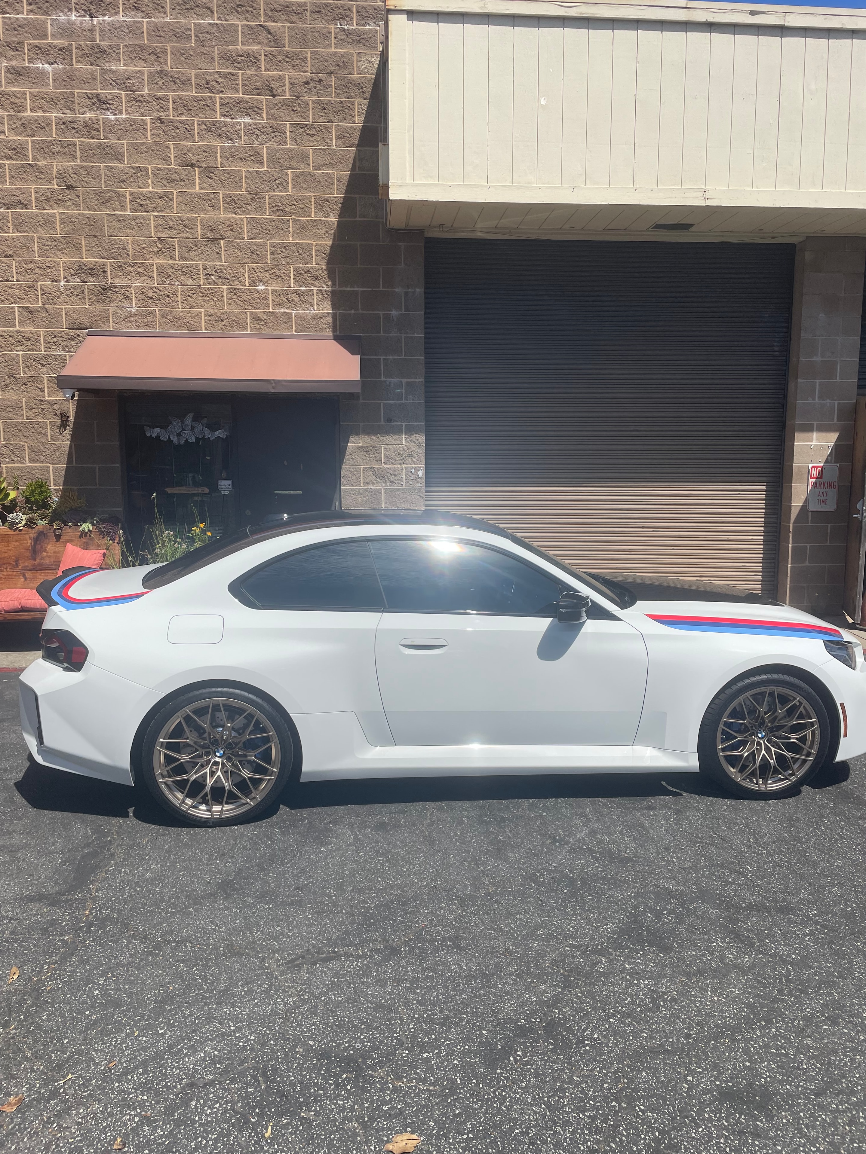 Watson's Window Tinting crew on JibPLUS lift – commercial window film installation